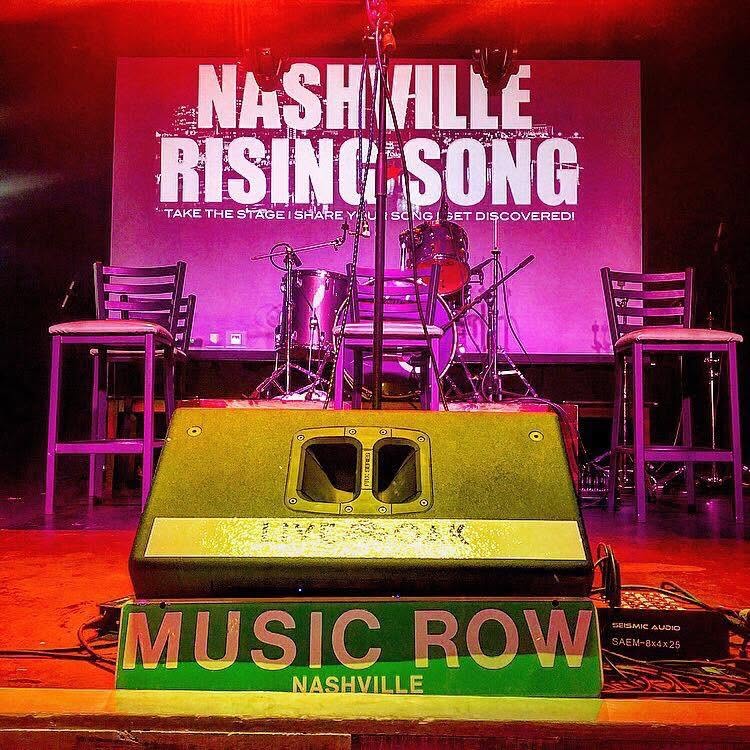 The Nashville Rising Song stage with a Music Row sign